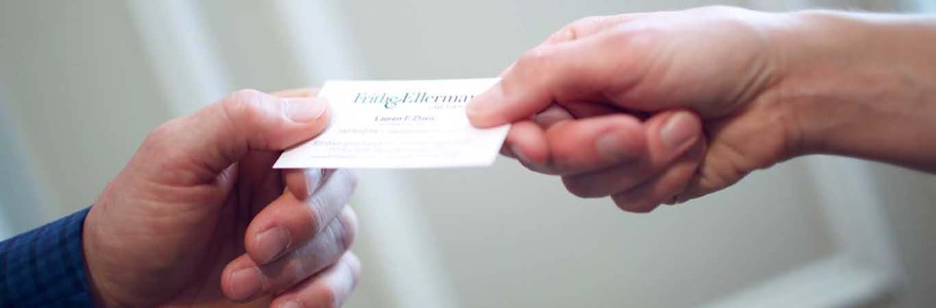 hands exchanging business card