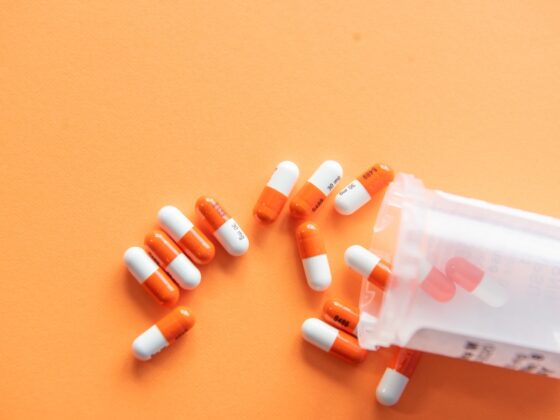 orange and white medication pill